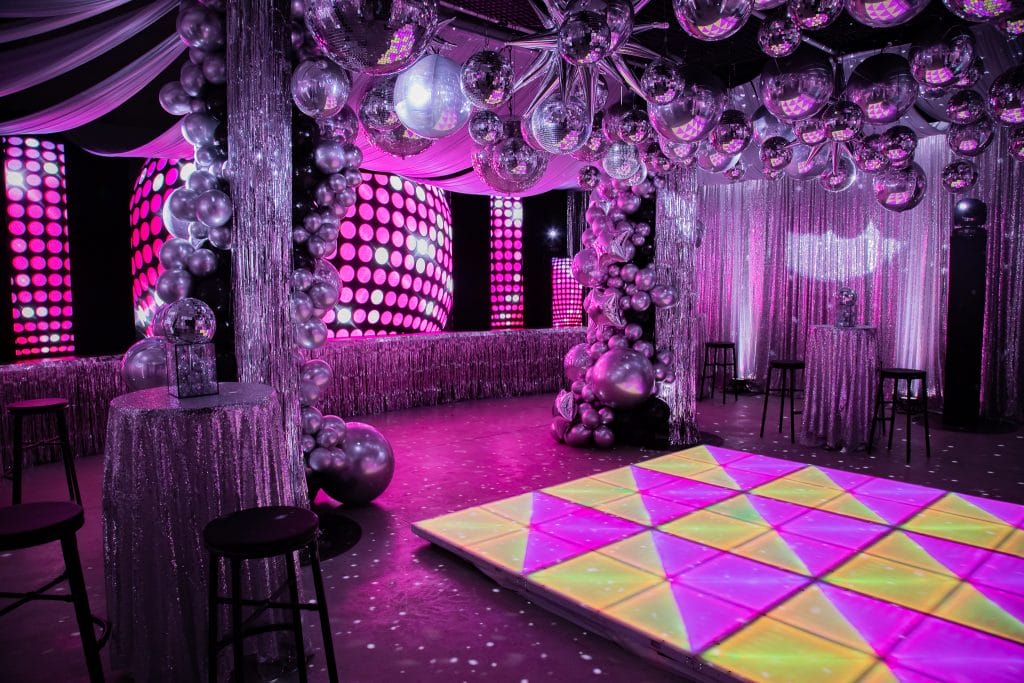 70s silver disco party balloon garland and illuminated led dance floor