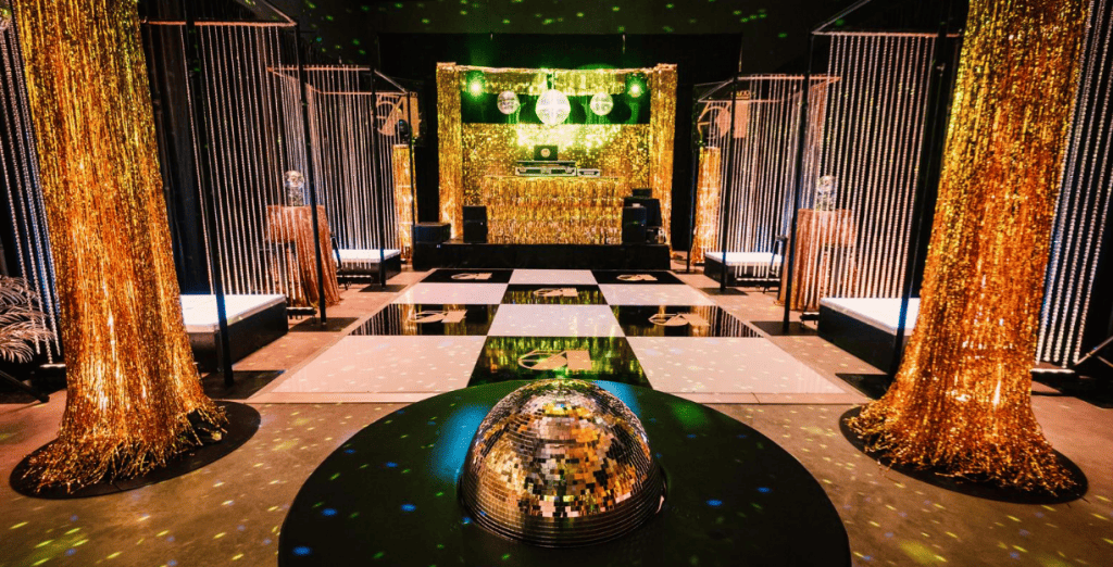 empty warehouse decorated and transformed into a studio 54 theme