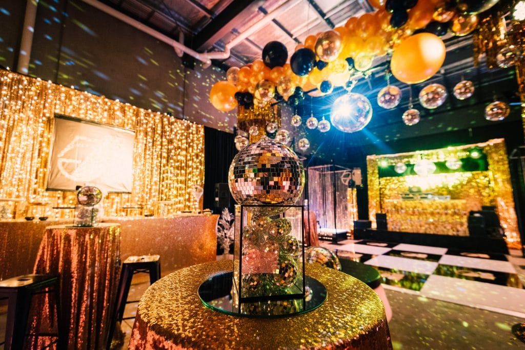 studio 54 themed party with mirror balls and themed props