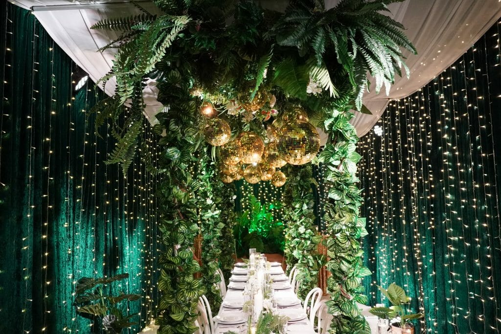 event decorating services tropical green and gold party theme