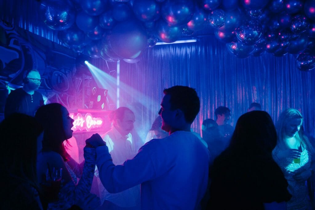 people dancing on dance floor at graffiti themed party throw a party at home without upsetting the neighbours