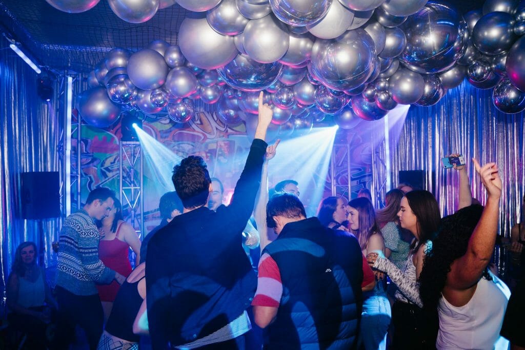 graffiti themed party people dancing on dance floor