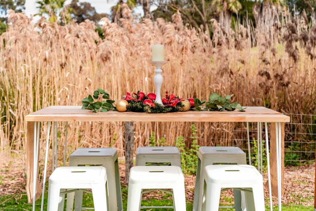 Bar tables and stools setup for christmas themed garden party