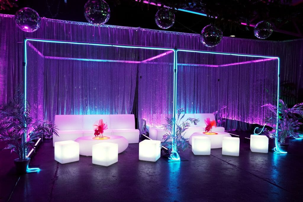 illuminated sofas, cubes, and coffee tables with beaded curtains, silver drape, neon lights and mirror balls party seating: how much do you need?