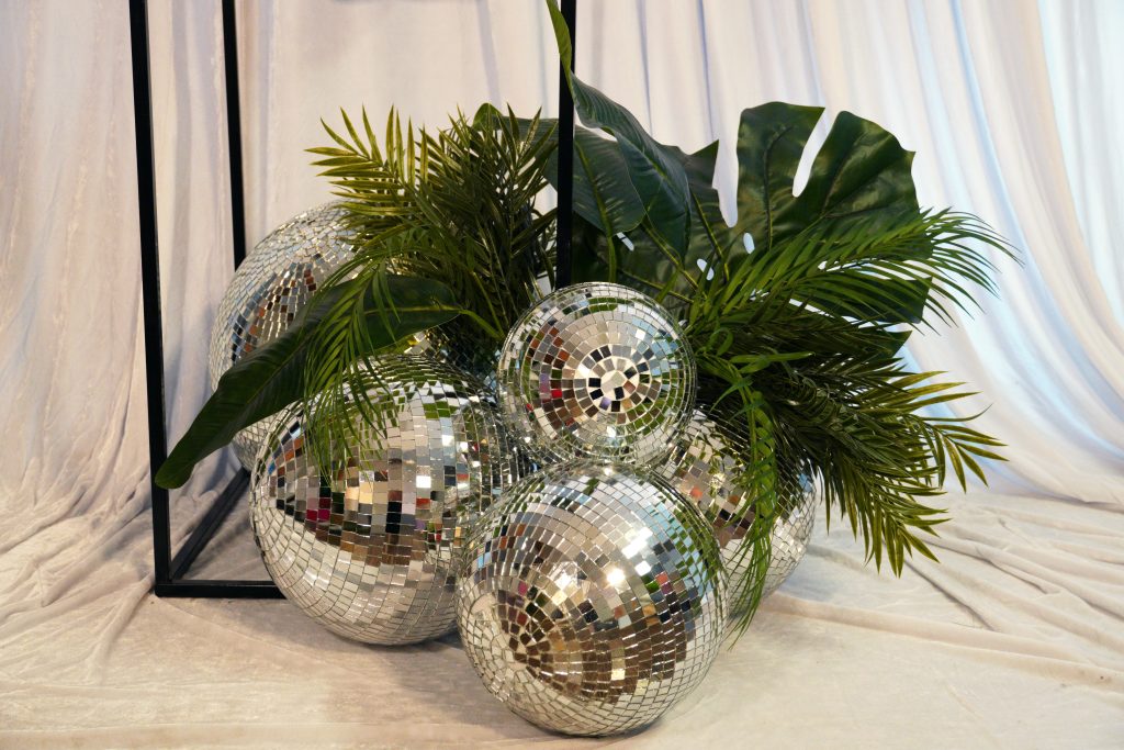 silver mirror balls and greenery Episode 3: A Week at Feel Good Events