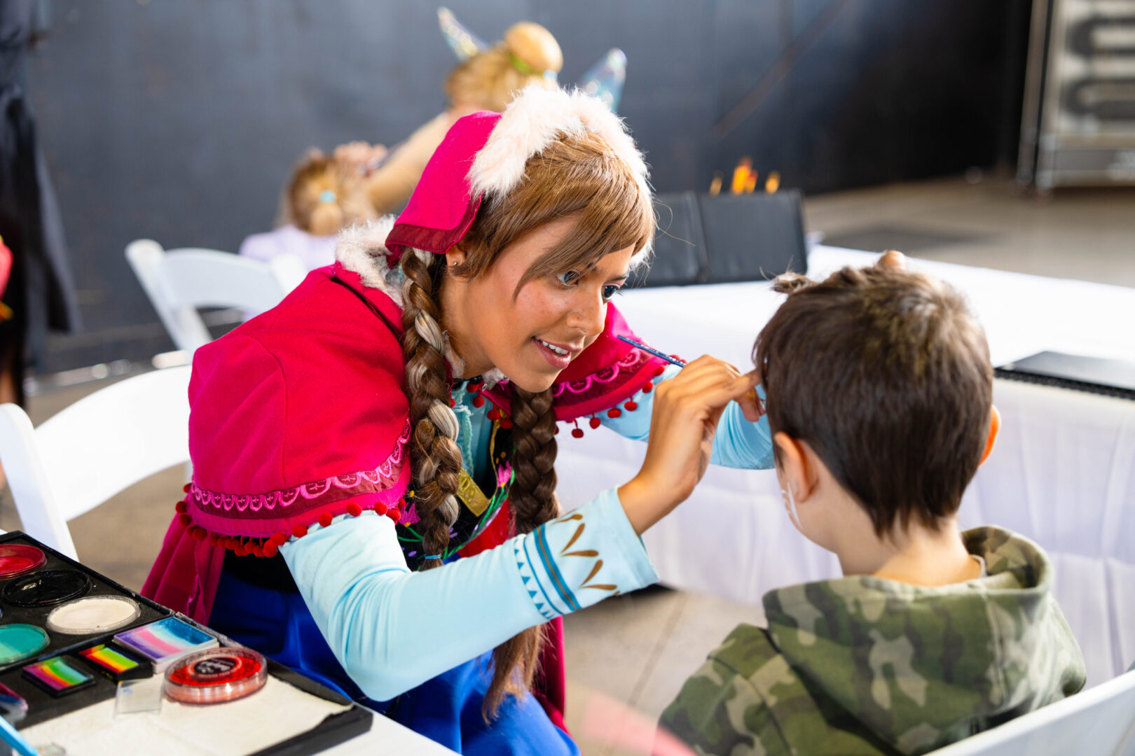 Face painting at Amiga Montessori Family Day 2023