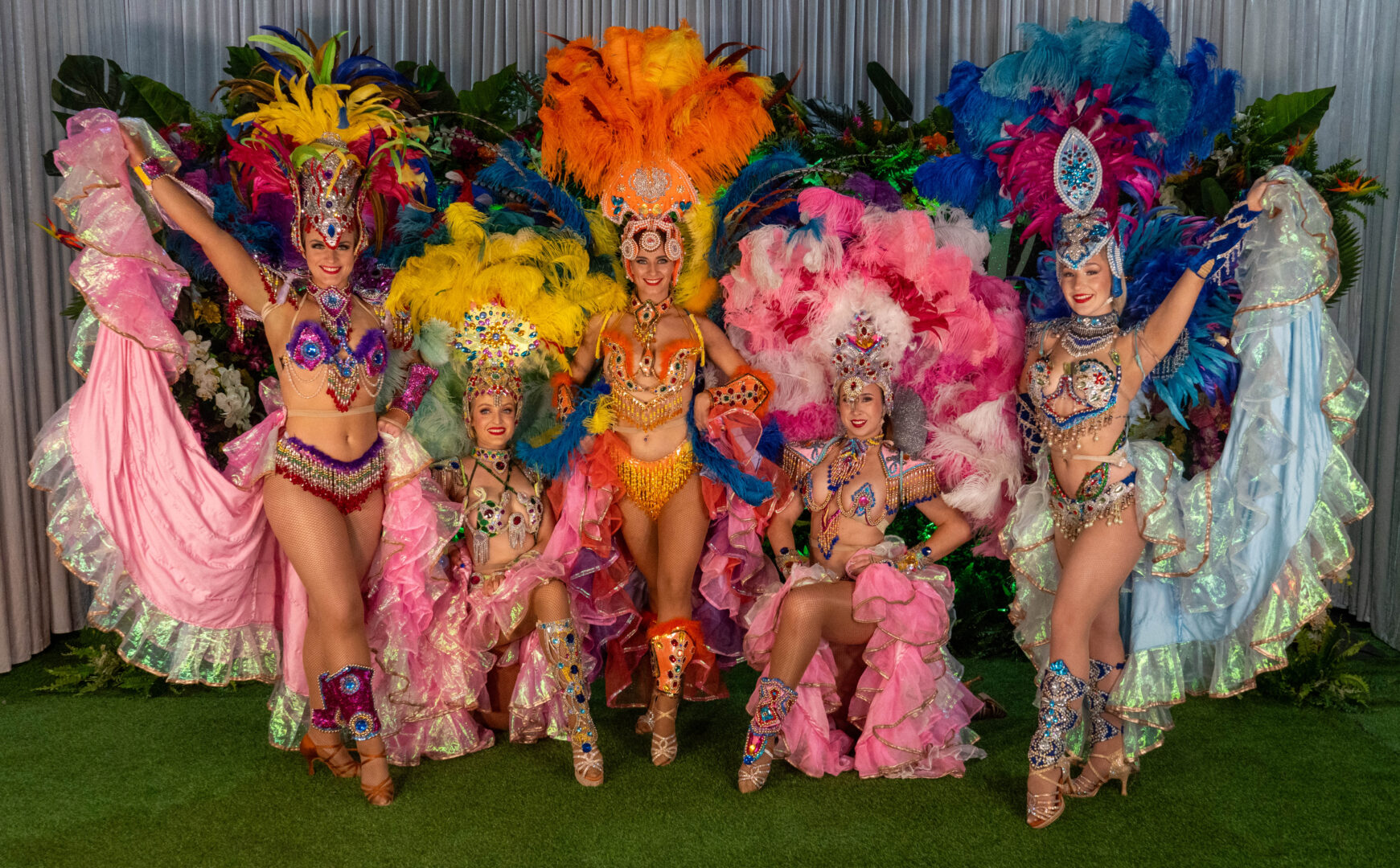 Brazilian dancers infront of a rio carnival backdrop