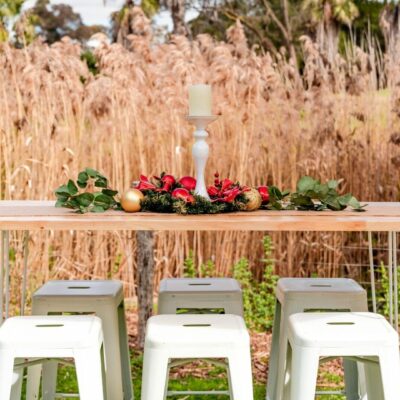 Bar tables and stools setup for christmas themed garden party