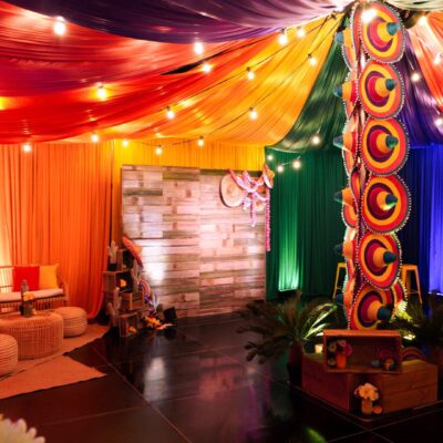 Colourful drape, rustic backdrop sombreros, festoon lights, artificial plants & flowers