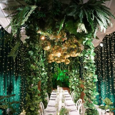 event decorating services tropical green and gold party theme