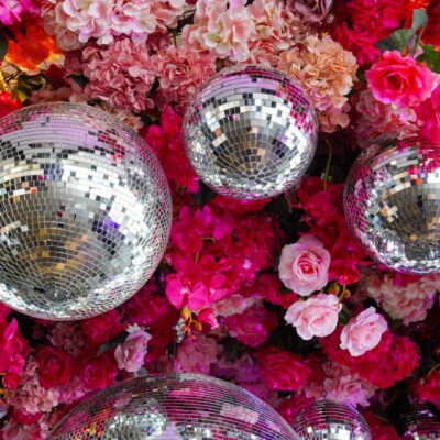 Pink floral and disco ball ceiling installation