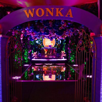 Wonka entrance gate to candyland themed party from warehouse to willy wonka wonderland