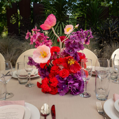 wedding reception setup with pink and purple florals