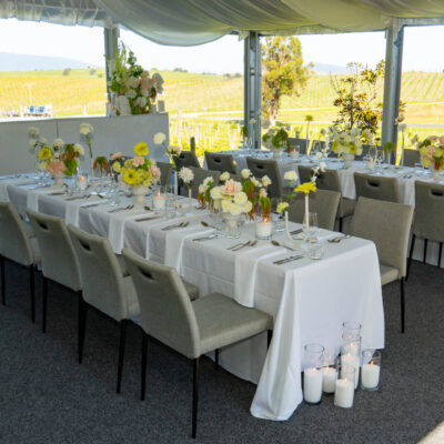 Wedding reception table setup with white linen, contemporary florals Balgownie Estate