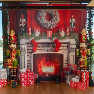 Scalzo Foods End of Year Event Themed festive backdrop setup with props, presents and trees