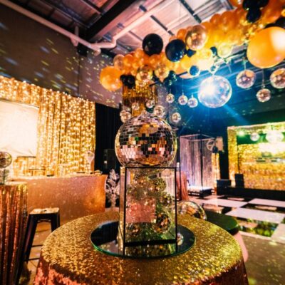 studio 54 themed party with mirror balls and themed props