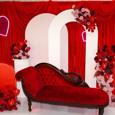 red love seat in styled valentine's day shoot