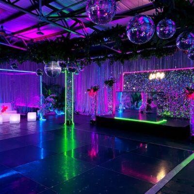 dance floor area with mirror balls and neon lights