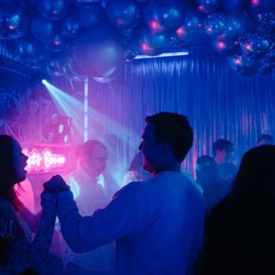 people dancing on dance floor at graffiti themed party throw a party at home without upsetting the neighbours